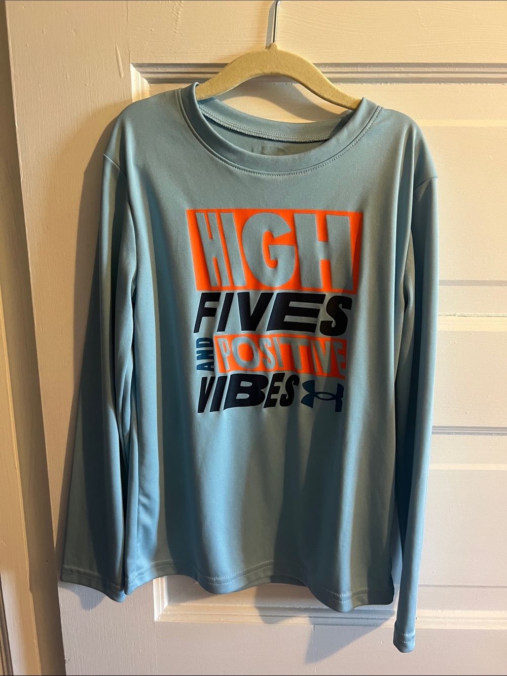 Under Armour Light Blue Long Sleeve Tee with Orange and Black Graphic Text